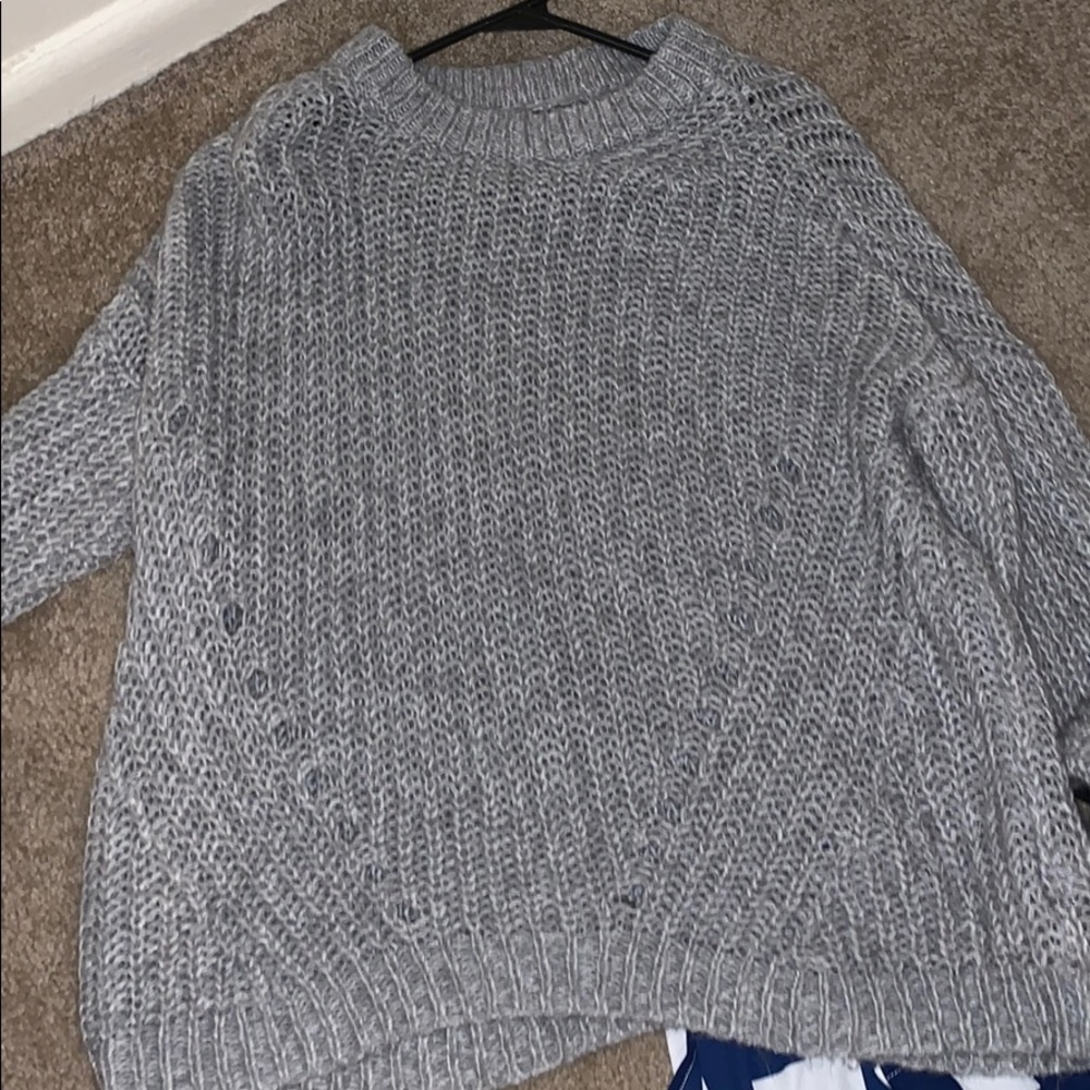 a gray sweater